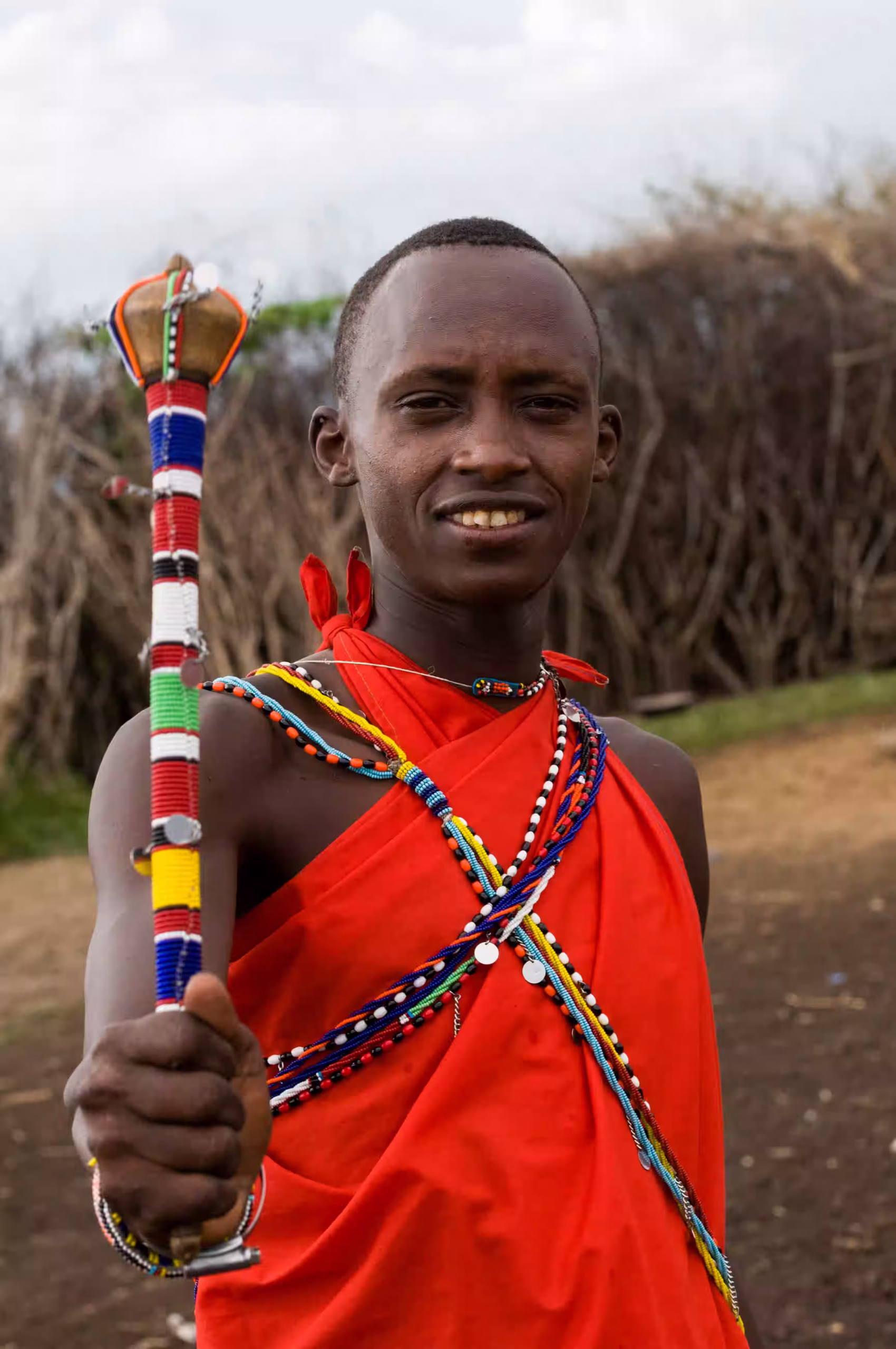 A young Maasai man in traditional beadwork