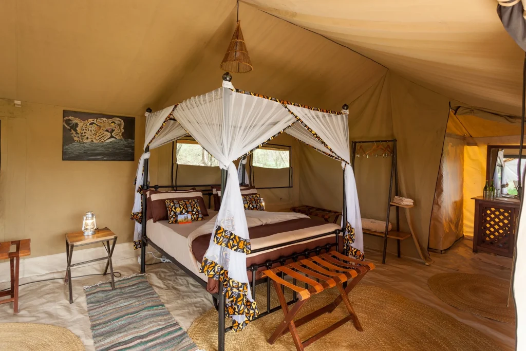 Double bed in a guest tent at Gnu Mara River Camp