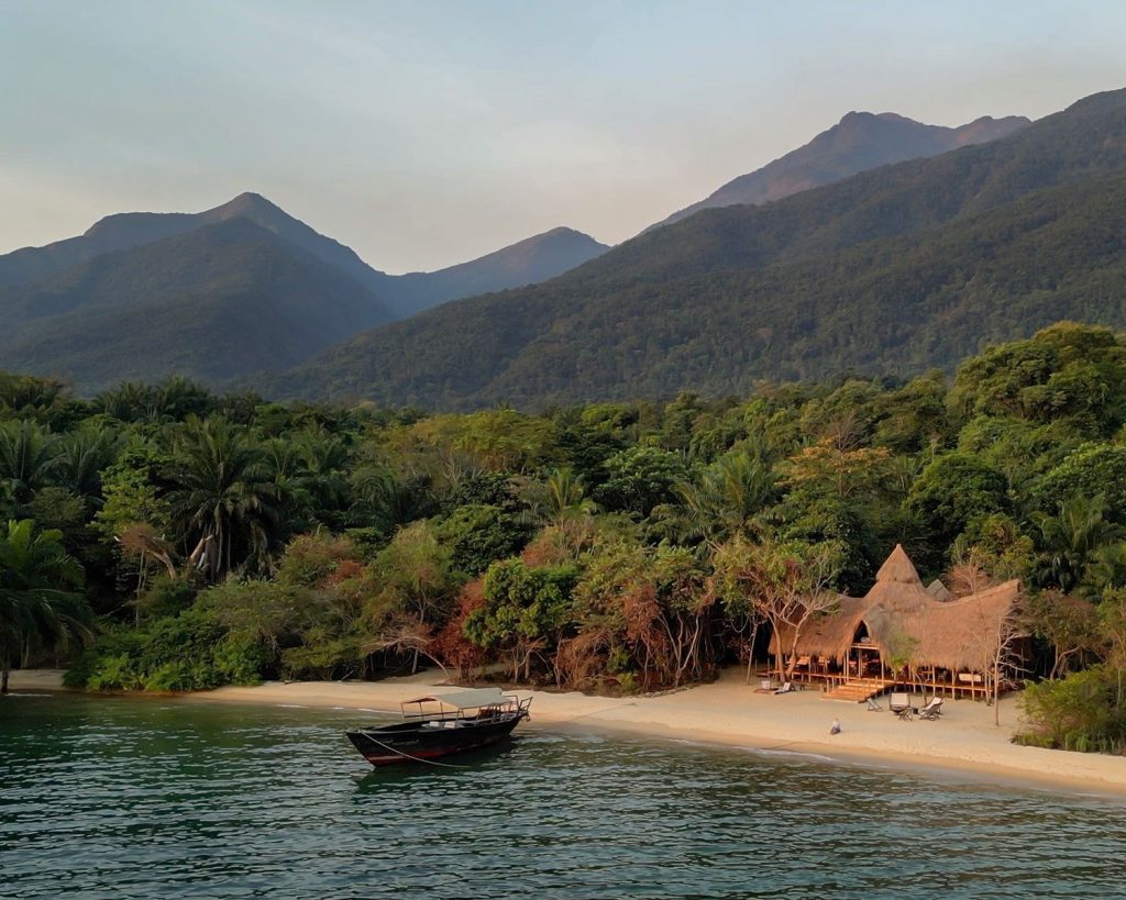 Greystoke Mahale: View from the shores of Lake Tanganyika to the lodge, with the Mahale Mountains behind