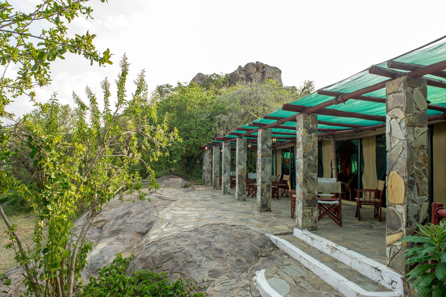 Mbuzi Mawe Serena Camp's tents around a granite kopje, from the air